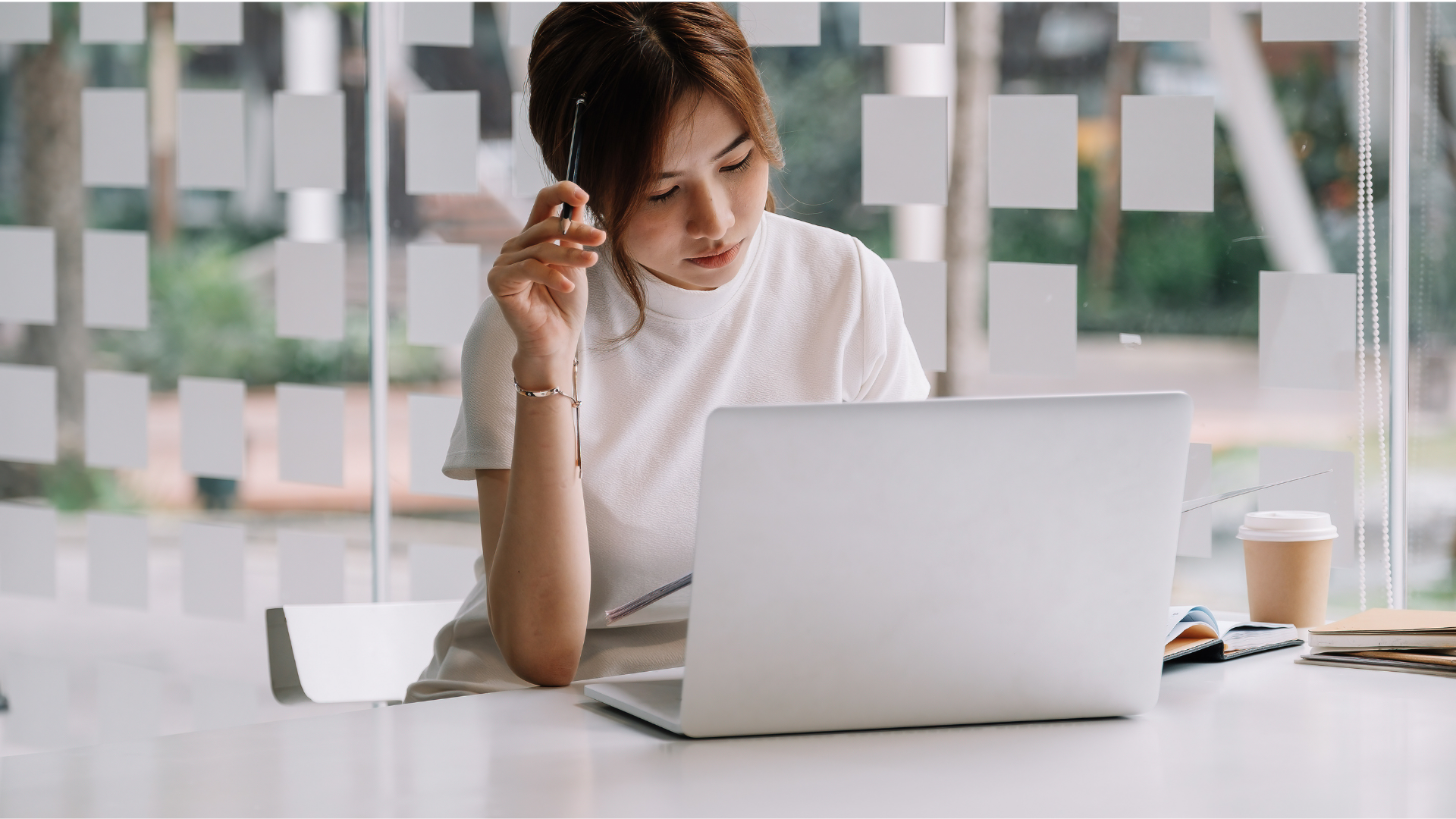 A paralegal studying eDiscovery on her laptop to ensure she's preparing for litigation.