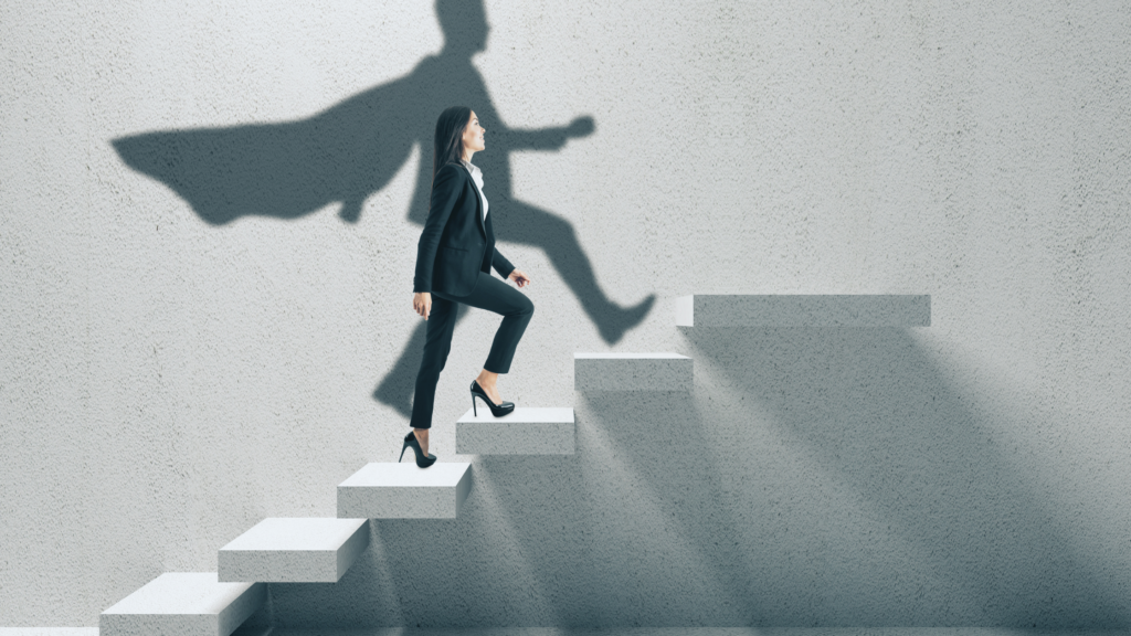 A paralegal climbing a set of stairs that represents her career with confidence represented by the shadow with a cape.