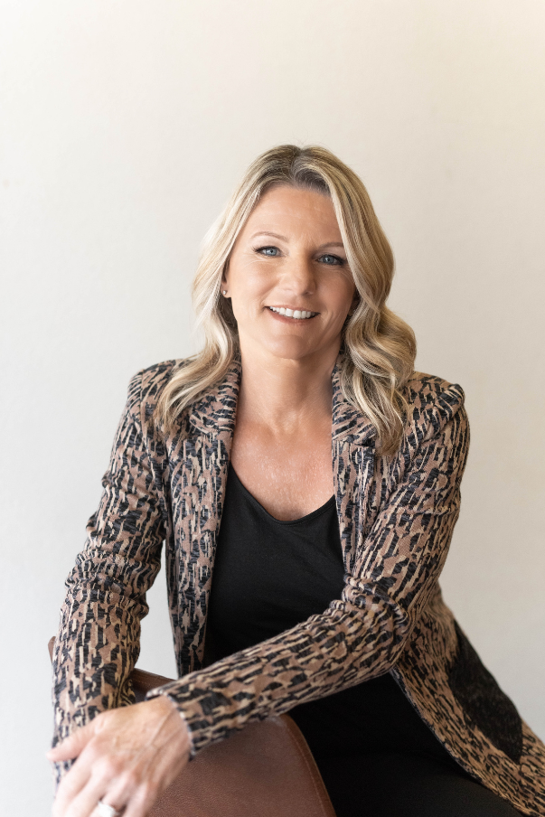 Ann Pearson dresses smartly and professionally as she poses for a picture to be used on the paralegal bootcamp website.