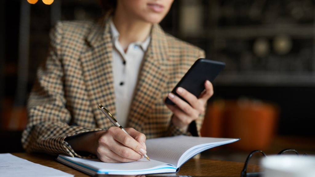 A paralegal operates her mobile phone and kits down the tips for mastering the paper flow in the paralegal world.