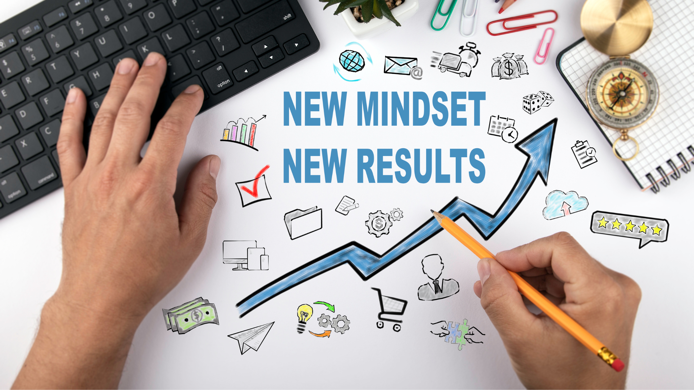 An image comprising a keyboard, paper clips, a compass, and a drawing that depicts a new mindset produces new results.