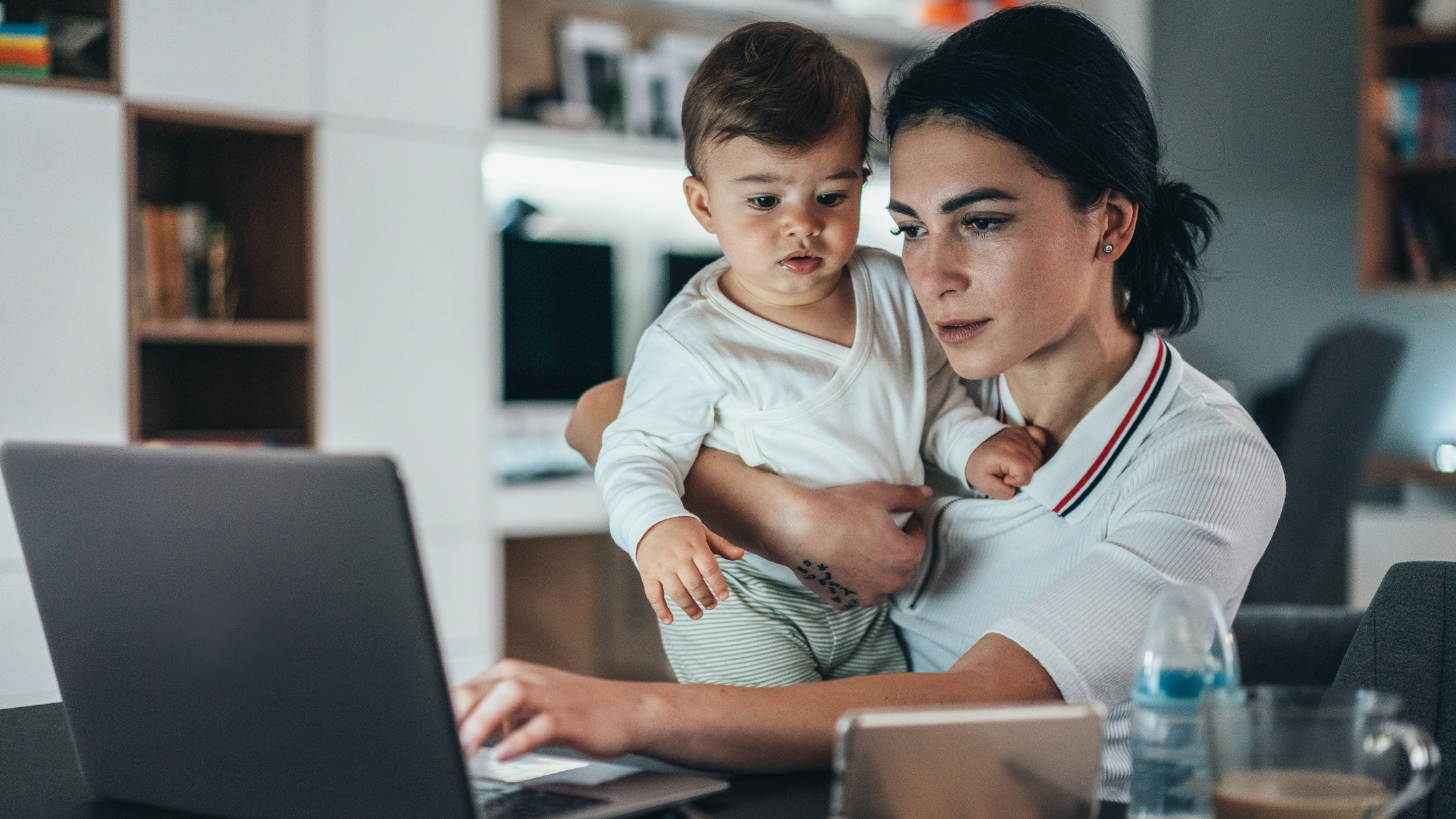 A paralegal mom carries her toddler son as she works on her legal projects, balancing being a mom and a paralegal.