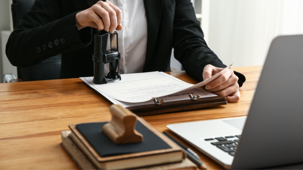 A paralegal notarizing a document, showing how being a notary member can help to become a successful personal injury paralegal.