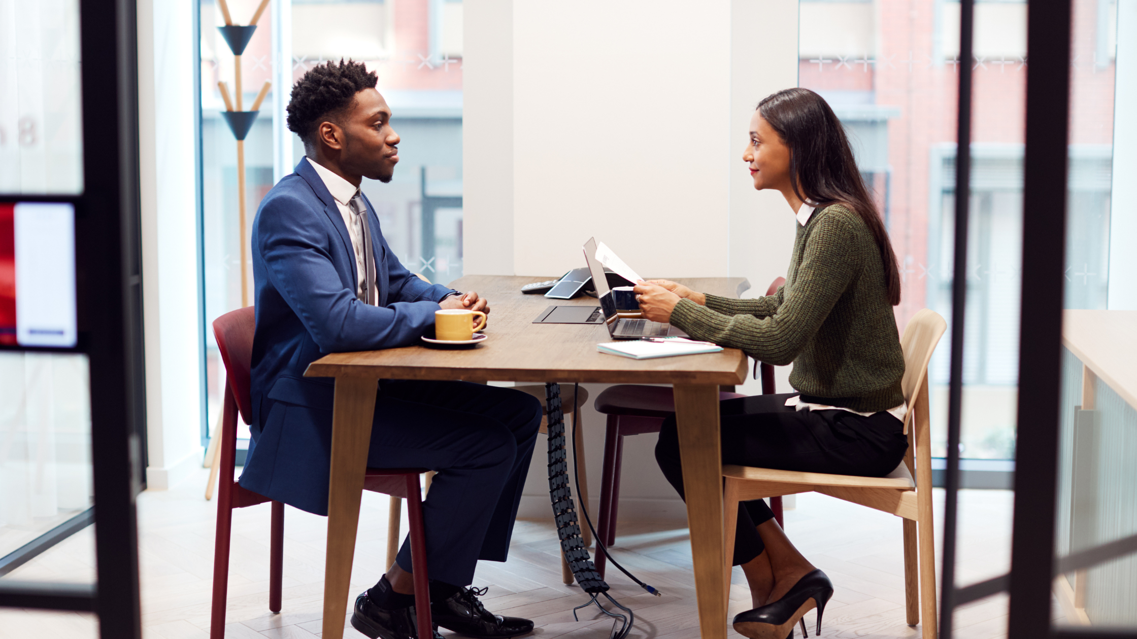 A paralegal intern sits for an interview before an attorney after learning ways to turn his internship into a job offer.