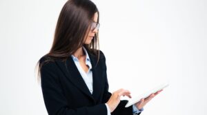 A businesswoman looking up some information on her tablet