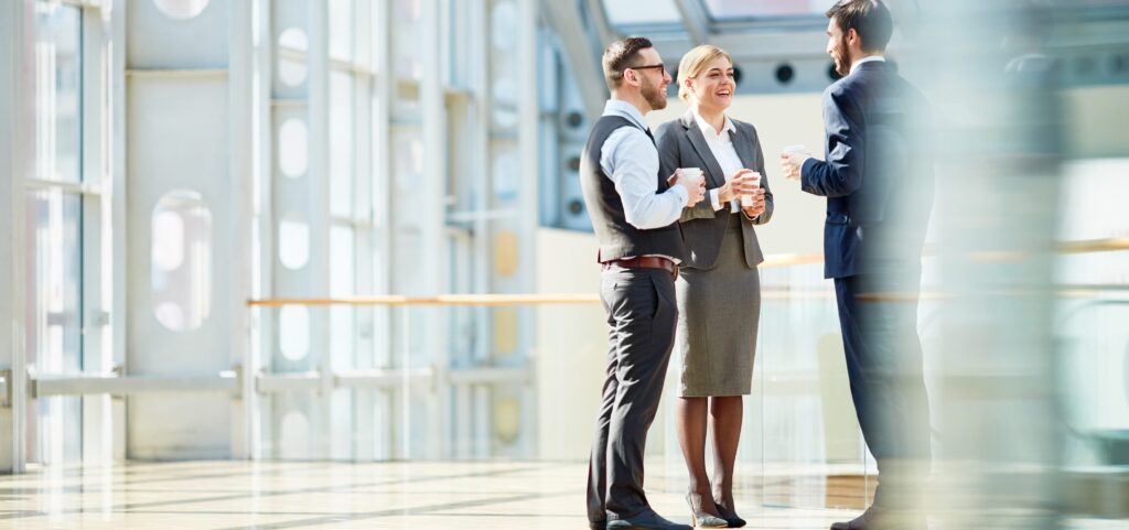 Litigation paralegal talking to attorneys