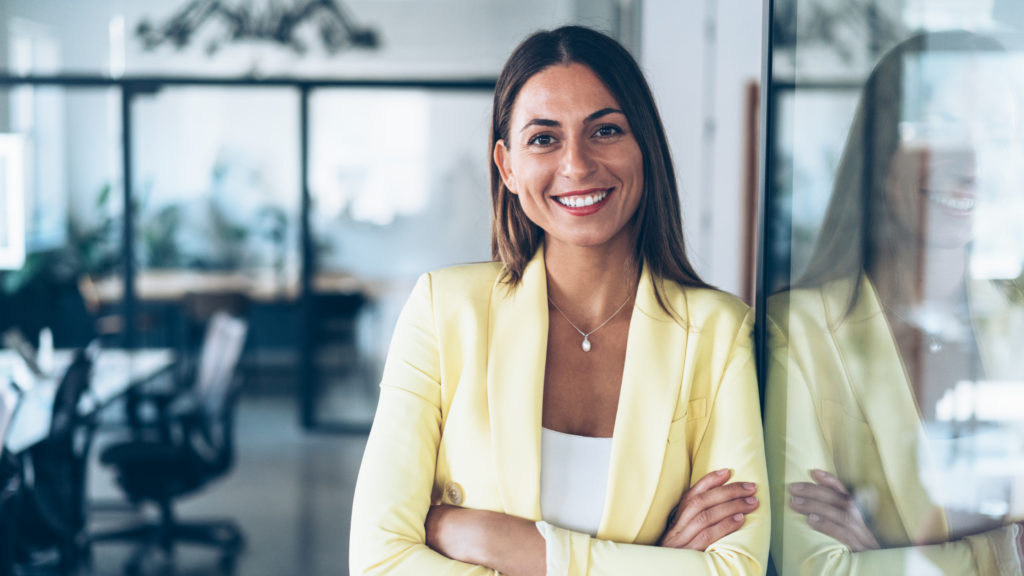 A paralegal's confidence shows through her smile, fashion sense, and ease in a law firm's general meeting room.