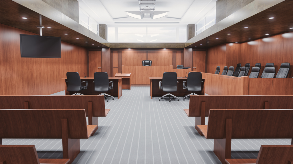 An empty courtroom with the appropriate furniture but no legal personnel depicts the role of a trial paralegal in any case.